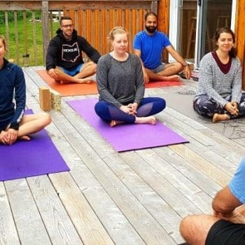 Outdoor group yoga on a deck