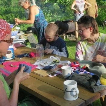kids and adults doing arts and crafts