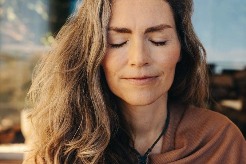 Healing Arts: A woman meditates as she finds peace at a wellness retreat at Cabot Shores.