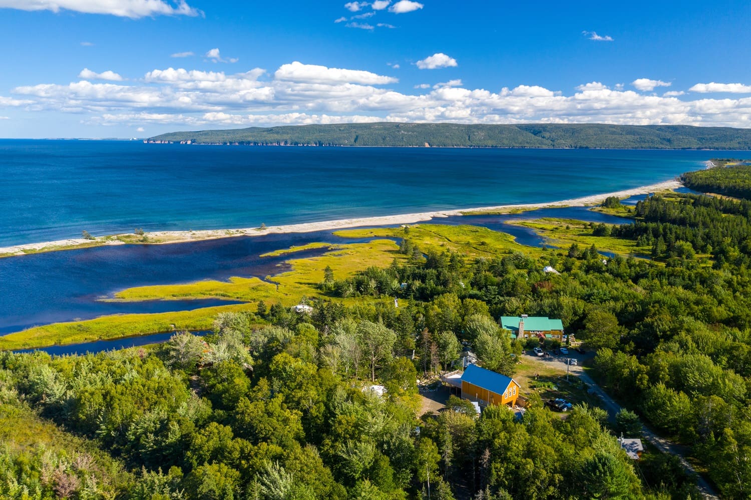 Water Adventures on Cape Breton: SUP, Canoe, and Kayak Tours An aerial view of Cabot Shores in the summer.
