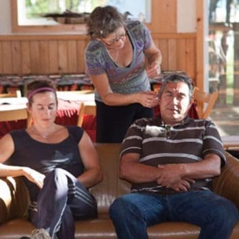 two people receiving acupuncture in main lodge