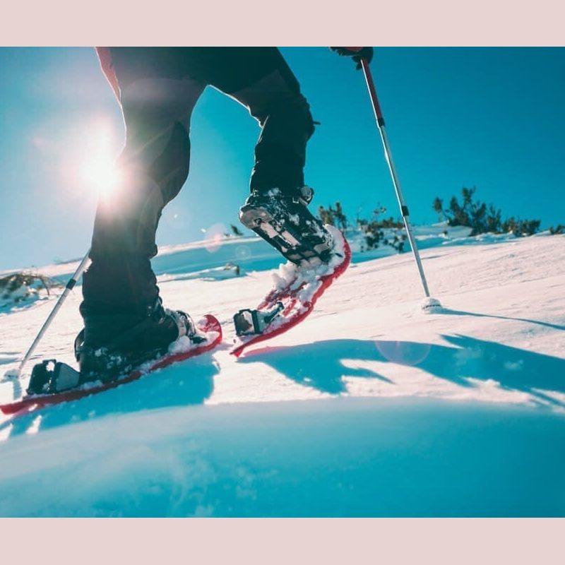 Packages-General A close up shot of an outdoor enthusiast enjoying Cape Breton hiking during winter with snowshoes.