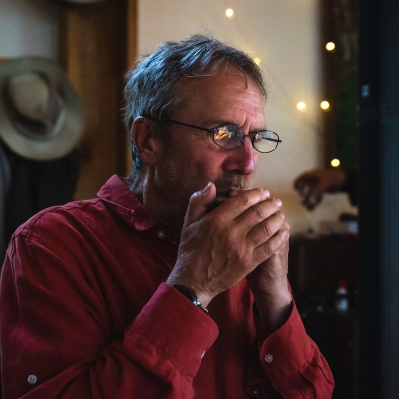 Packages-General Paul playing harmonica