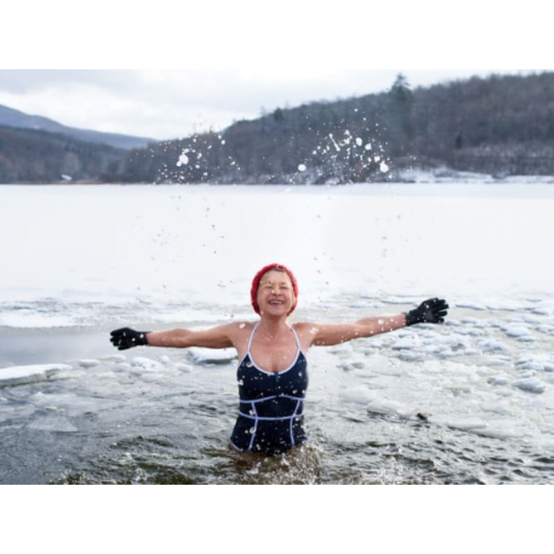 Packages-General Wim Hof Method: A young woman embraces cold immersion therapy amid the icy waters of Cape Breton Island.