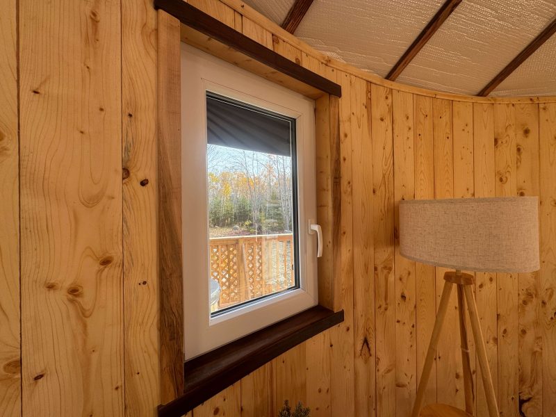 The Highlands Yurt at Cabot Shores Hand-carved wooden window frames in the Highland Yurt