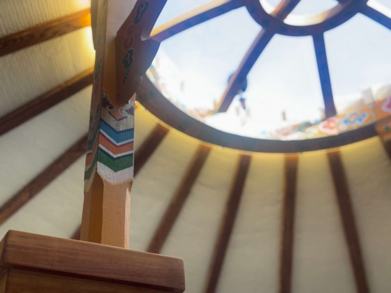 The Highlands Yurt at Cabot Shores Interior pinewood framing of the Highland Yurt with Mongolian-inspired tono art on the roof